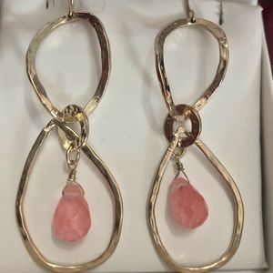 Dangling earrings with pink cabriolet stones.